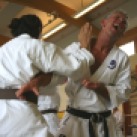 Jo Reyes and Mark Searson practice kumite drills.